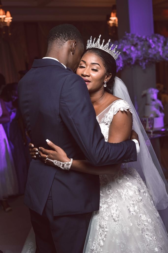Beautiful moment of a couple embracing during their wedding dance.